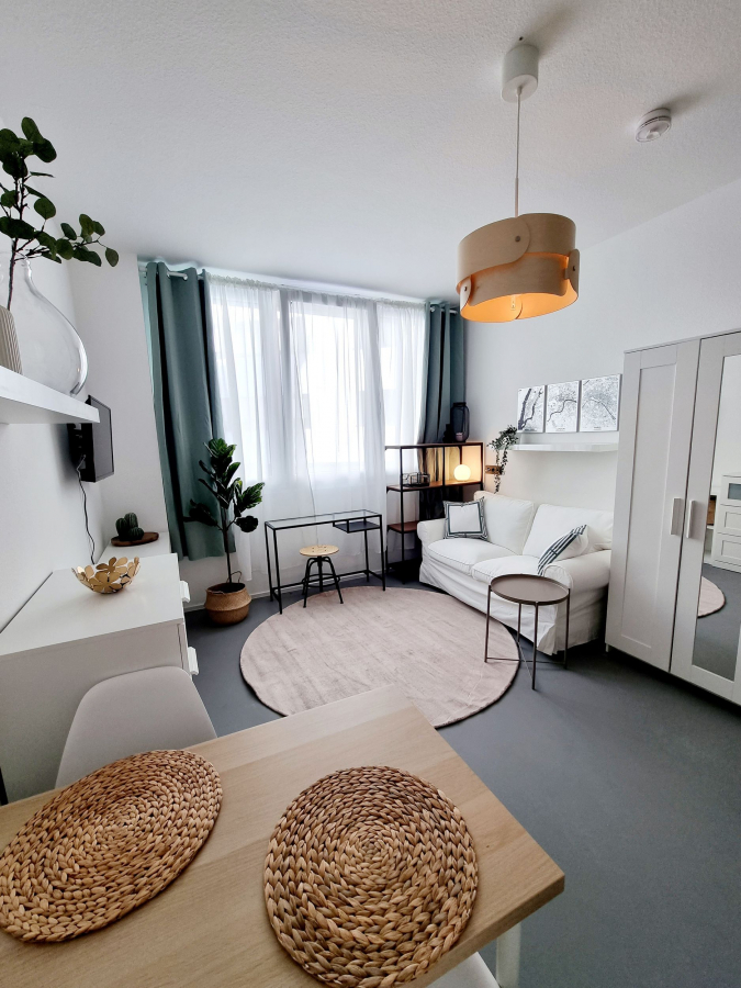 Wohnzimmer 1.2 Wohnzimmer 1.2 - Geschmackvoll möbliertes Apartment in City-Lage