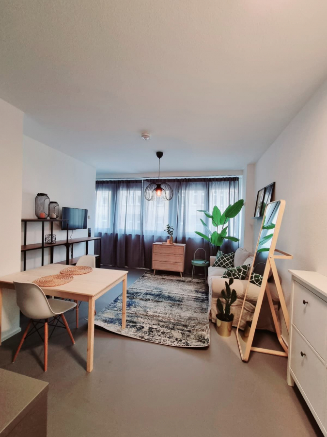 Wohnzimmer 1.3 Wohnzimmer 1.3 - Geschmackvoll möbliertes Apartment in City-Lage